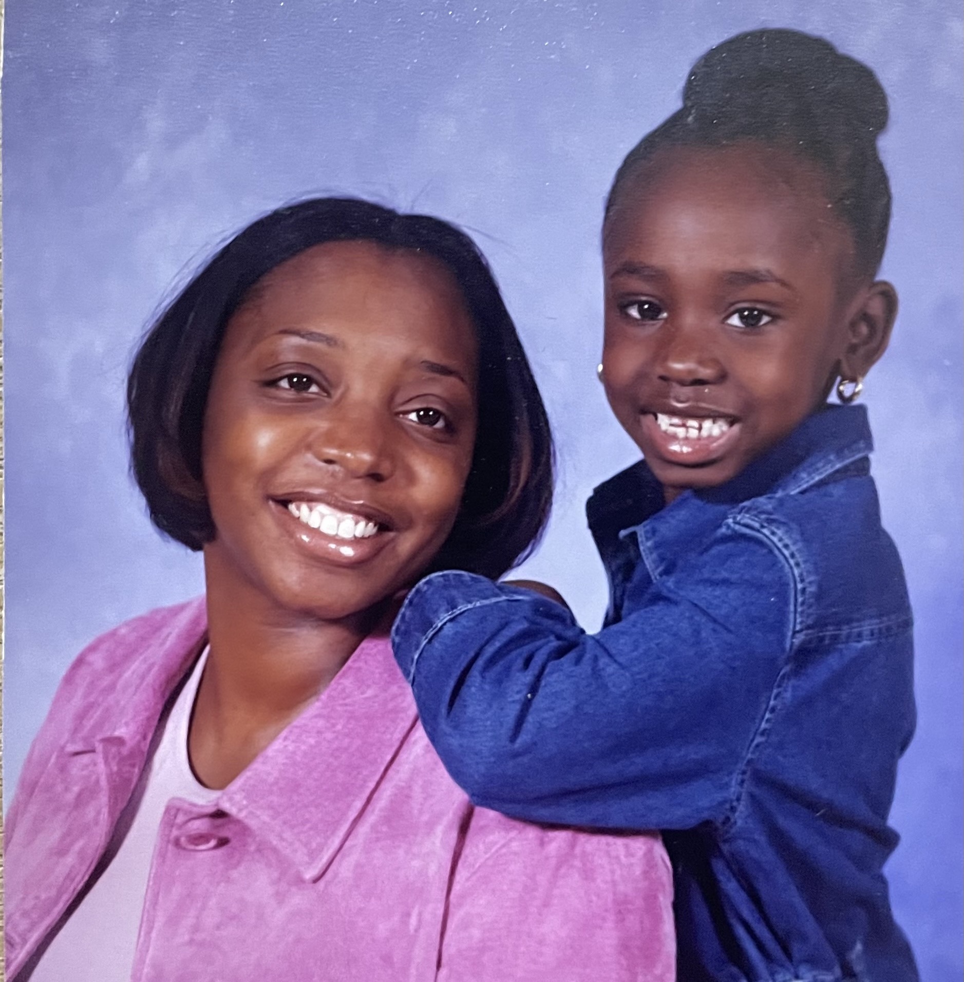 Sadasia McCutchen as a child posing with her mother 