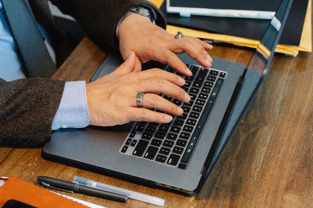 Person typing on a laptop 