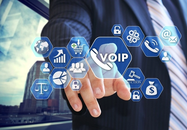 Business person pointing to VoIP icons