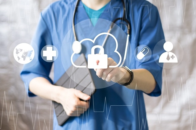 Healthcare provider touching graphic icons illustrating health data in the cloud