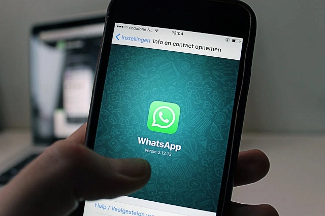 Smartphone with WhatsApp app on the screen