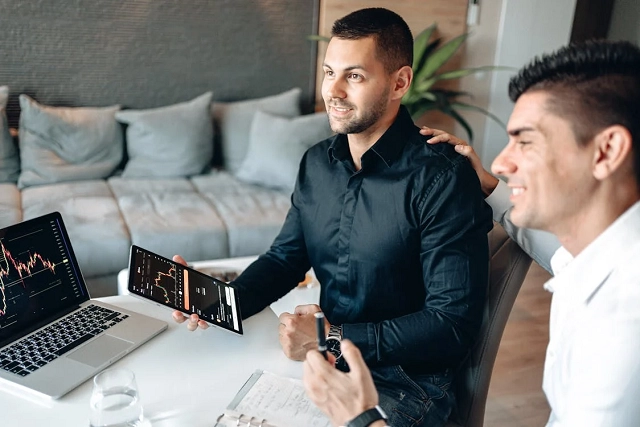 Coworkers working remotely in a living area