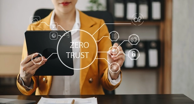 Person using devices with Zero Trust graphic overlay